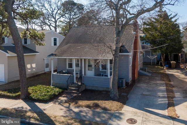 view of front of home featuring central AC unit and a porch