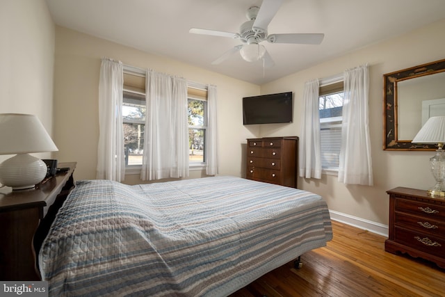 bedroom featuring hardwood / wood-style floors and ceiling fan