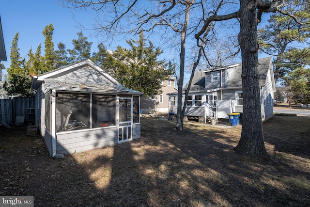 view of yard with a sunroom