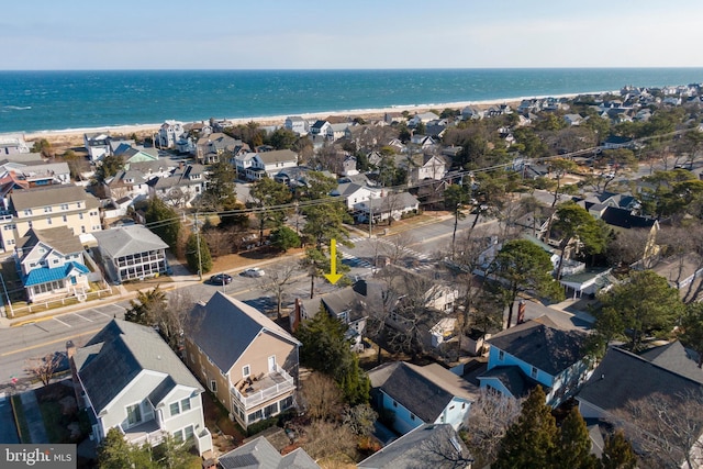 aerial view with a water view and a view of the beach