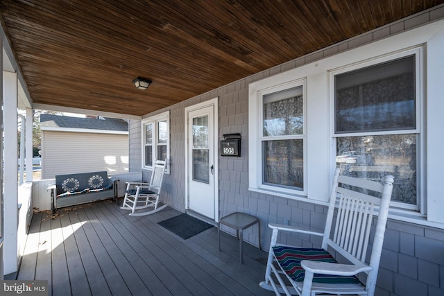 wooden terrace featuring a porch