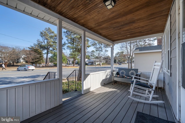 wooden deck featuring covered porch