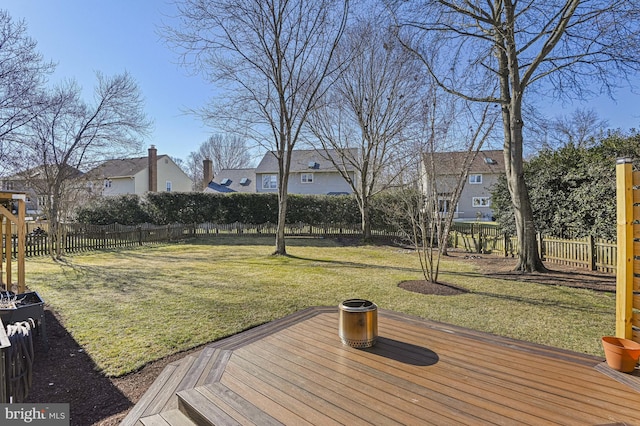 wooden terrace with fence and a lawn