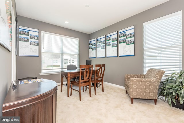 dining room featuring light colored carpet