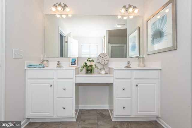 bathroom featuring vanity and an enclosed shower