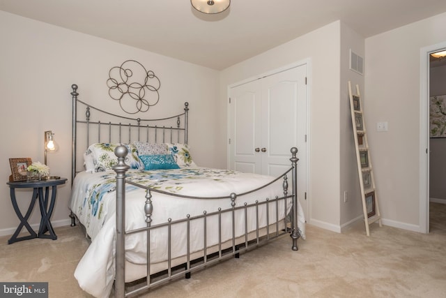 carpeted bedroom with a closet