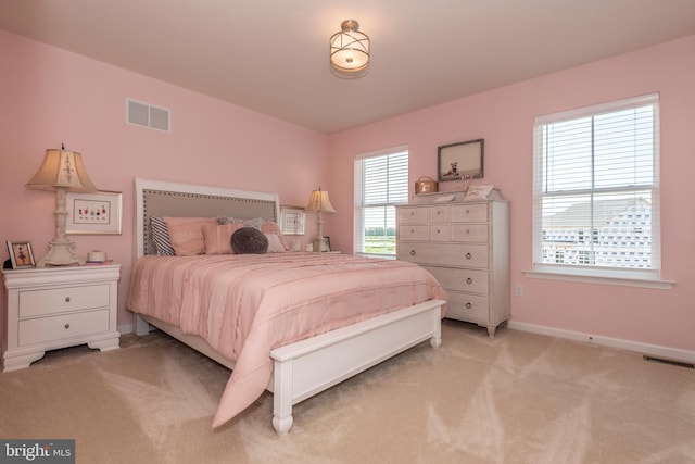 bedroom with light carpet