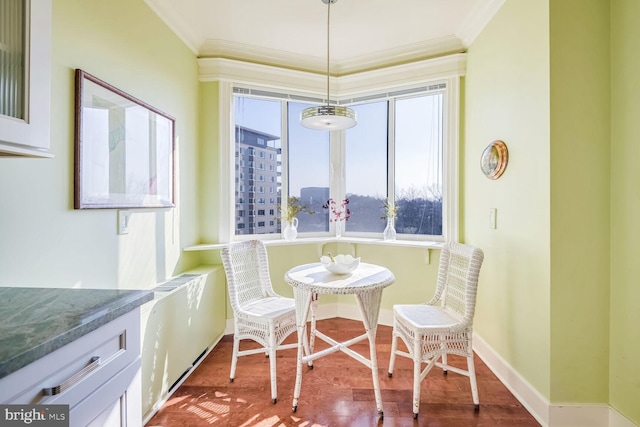 dining room featuring wood-type flooring and ornamental molding