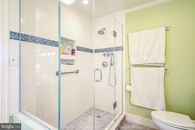 bathroom featuring crown molding, toilet, and walk in shower