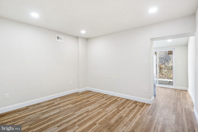 empty room with light hardwood / wood-style floors