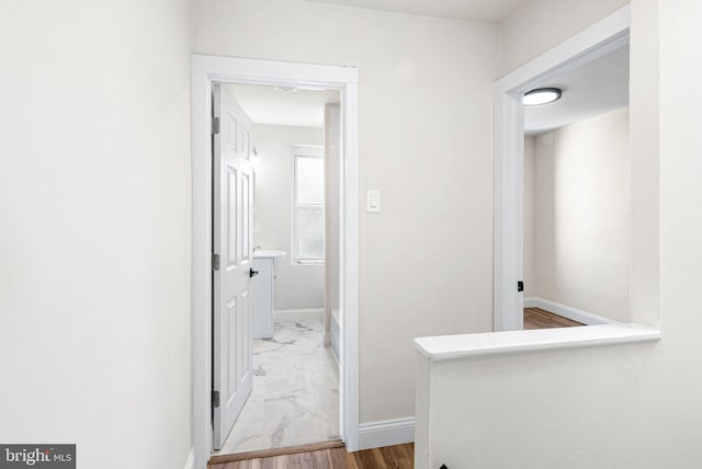 corridor featuring hardwood / wood-style flooring