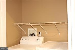 laundry room featuring separate washer and dryer