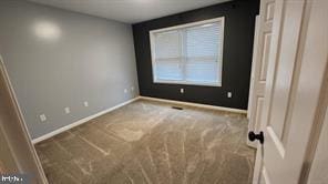 empty room featuring carpet floors