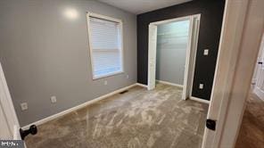 unfurnished bedroom featuring carpet