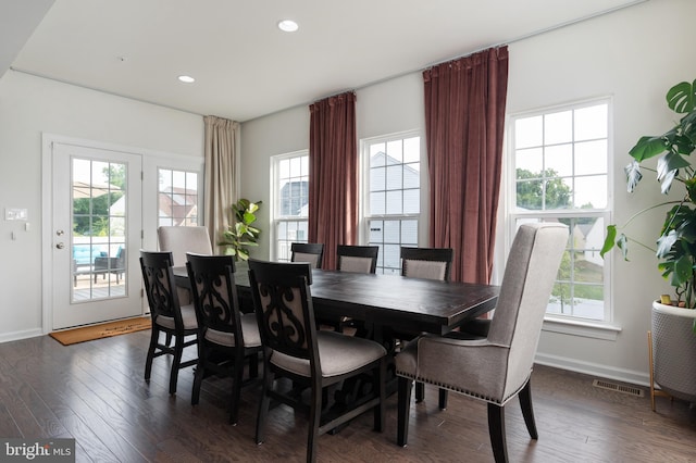 dining room featuring dark hardwood / wood-style floors and plenty of natural light