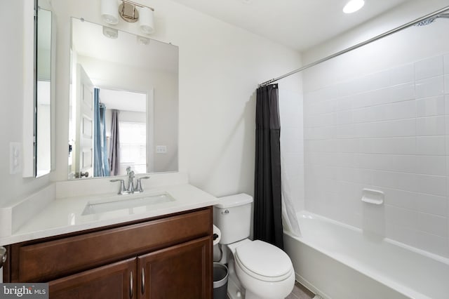 full bathroom with toilet, shower / bath combo, and vanity