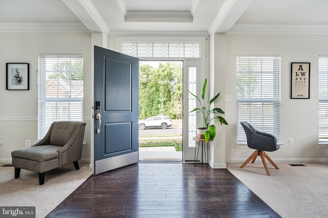 foyer with crown molding and dark hardwood / wood-style flooring