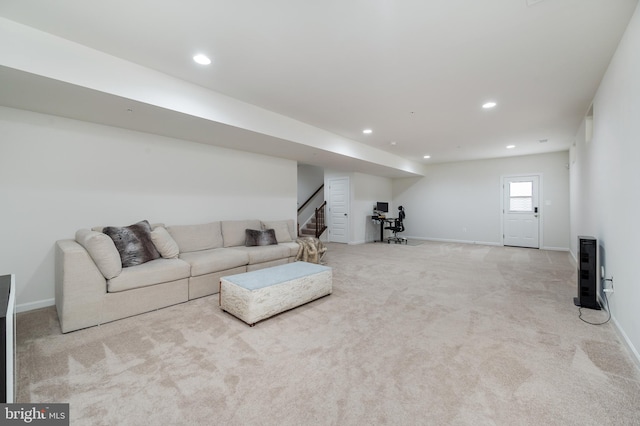 unfurnished living room with light colored carpet