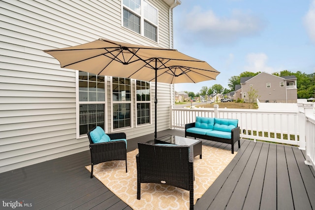 wooden terrace with an outdoor hangout area