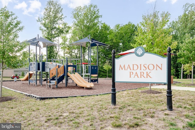 view of playground with a lawn