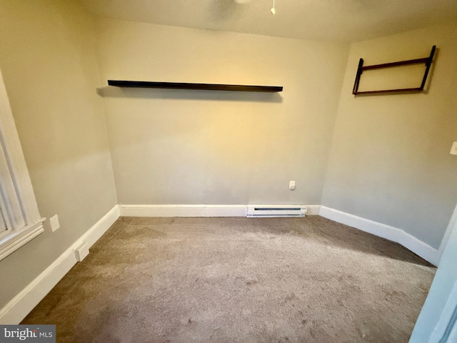 unfurnished room featuring baseboards, carpet, and a baseboard radiator