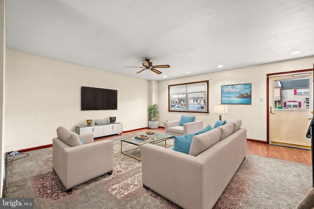 living room featuring plenty of natural light, hardwood / wood-style floors, and ceiling fan