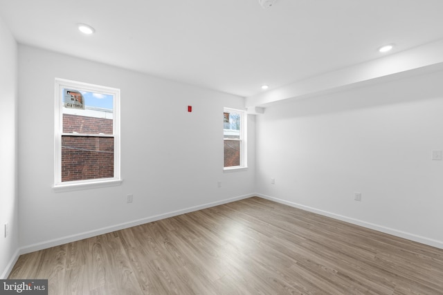 spare room featuring light hardwood / wood-style floors