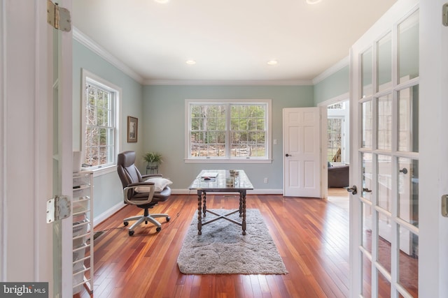 sitting room featuring hardwood / wood-style floors, french doors, baseboards, and ornamental molding