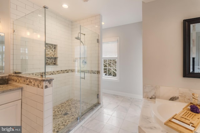 full bathroom with vanity, baseboards, recessed lighting, a stall shower, and a garden tub