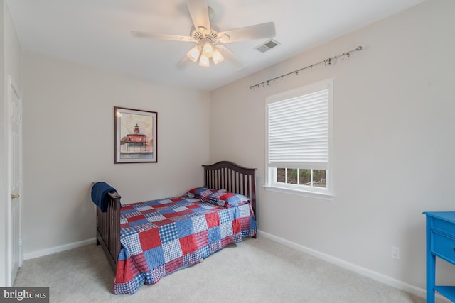 bedroom with visible vents, baseboards, ceiling fan, and carpet flooring