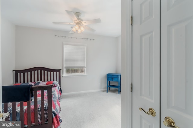 carpeted bedroom featuring ceiling fan and baseboards