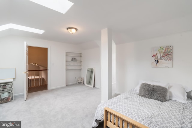 bedroom featuring carpet flooring and a skylight