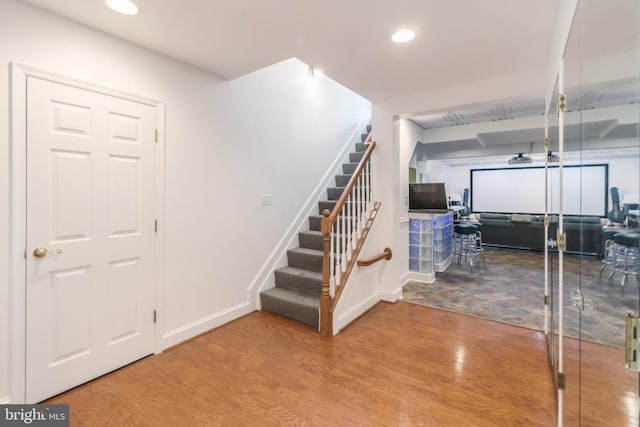 interior space featuring recessed lighting, wood finished floors, and baseboards