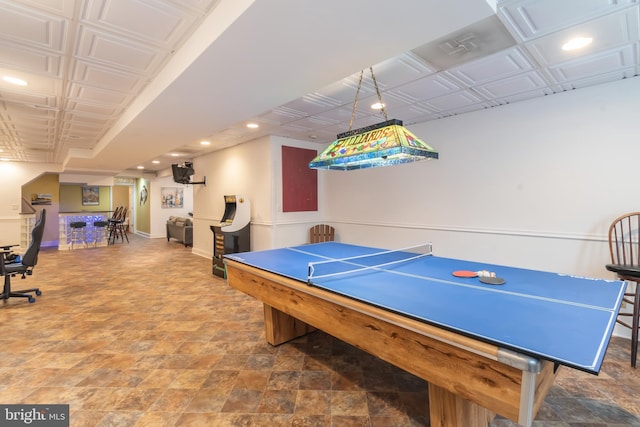 rec room with recessed lighting, baseboards, an ornate ceiling, and stone finish floor