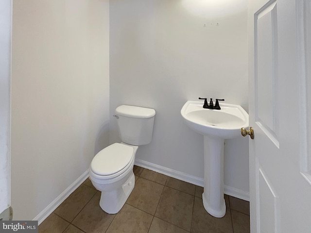 bathroom featuring tile patterned floors and toilet