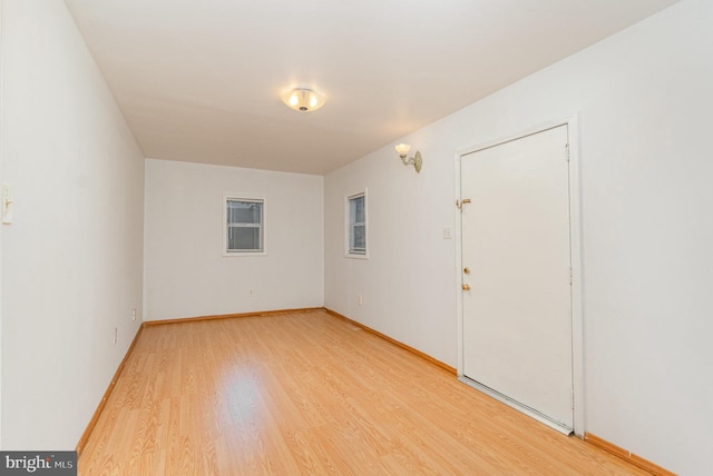 spare room with light wood-type flooring