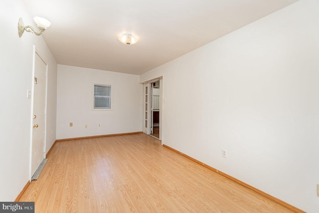 unfurnished room featuring light hardwood / wood-style floors