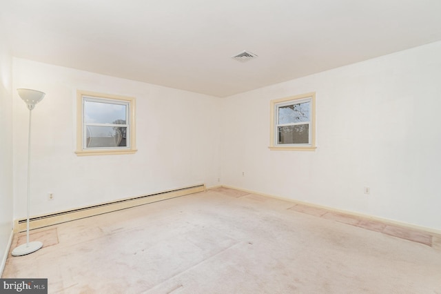 spare room with a baseboard radiator and carpet flooring