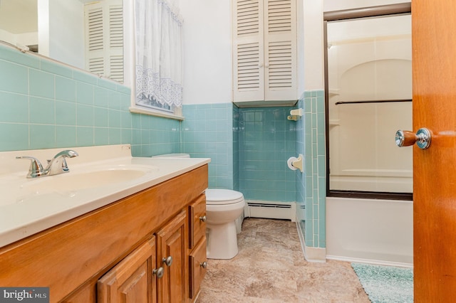 bathroom featuring vanity, tile walls, baseboard heating, and toilet