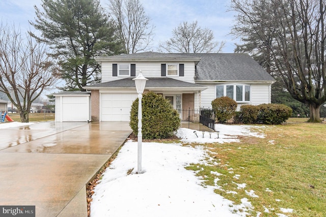 view of front of house with a garage and a front lawn