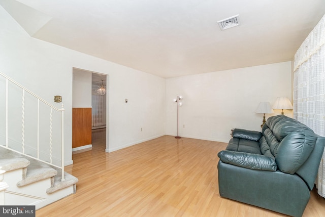 sitting room with wood-type flooring