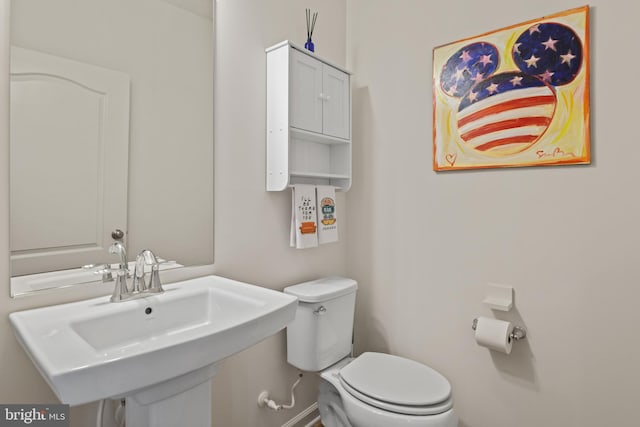 bathroom with a sink and toilet