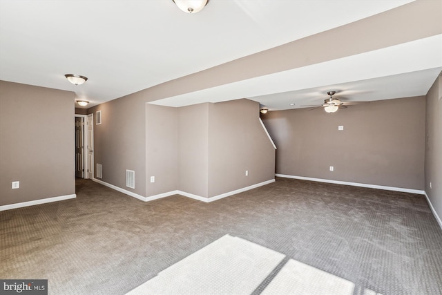 interior space featuring carpet floors and ceiling fan