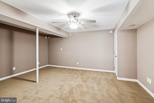 basement with carpet floors and ceiling fan