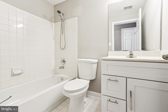 full bathroom with tile patterned floors, toilet, tiled shower / bath combo, and vanity