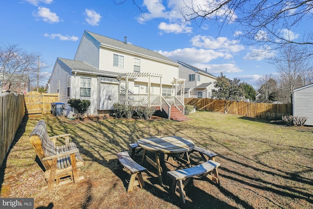 rear view of property with a lawn and a pergola