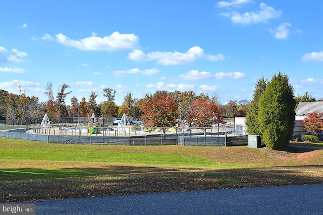 exterior space featuring a playground and a lawn