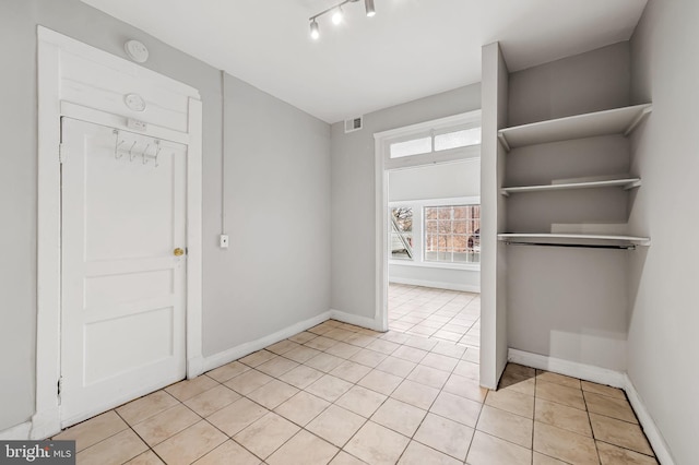 interior space with light tile patterned floors