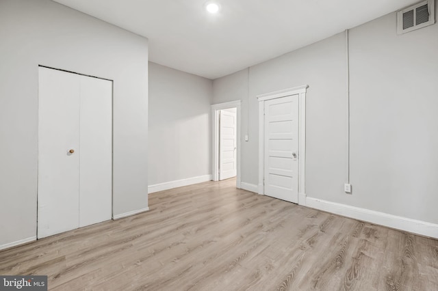 unfurnished bedroom with light hardwood / wood-style flooring