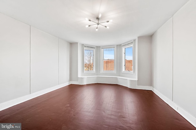 spare room with dark hardwood / wood-style floors